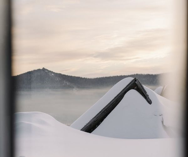 Silhouette of a person doing yoga during a sunrise.